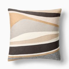 a pillow with an abstract design on it