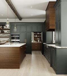 a large kitchen with wooden cabinets and marble counter tops