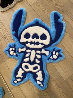 a blue and white rug with a skeleton on it