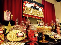 an assortment of candy and candies displayed on a table