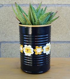 a potted plant sitting on top of a wooden table