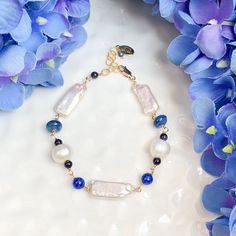 Limited edition, unique shape fresh water Pearls and Lapis accented bracelet. 7-8”. Available in Silver or 14k Gold filled (shown) this could be your “something blue” to wear at your special day. Elegant Beaded Bracelets With Lapis Lazuli, Elegant Handmade Blue Pearl Bracelet, Elegant Blue Pearl Bracelet With Charm, Adjustable Hand-strung Blue Pearl Bracelet, Chocolate Jewelry, Silver Lapis Lazuli Hand-strung Beaded Bracelets, Beading Jewelery, Real Gold, Pearl Bracelet