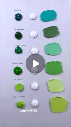 some green and white paint swatches are arranged on a table with the words,