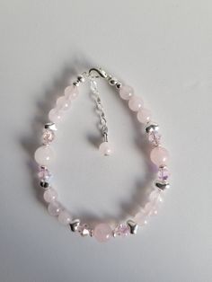 The Rose Quartz, Lt. Rose Swarovski crystal and Sterling Silver heart beads and findings including a 1" beaded extension and a lobster claw clasp. It's 7.25" long.  Custom Orders are always welcome! Ask about free sizing. Sterling Silver Heart Bracelet, Rose Quartz Pink, Crystal Bead Jewelry, Pretty Jewelry Necklaces, Silver Heart Bracelet, Quartz Pink, Cluster Bracelets, Pink Swarovski, Kawaii Jewelry