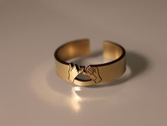 This gold-filled pinky promise ring is an ideal gift to symbolize your strongest bond with a loved one. Its unique cutout design is a modern representation of the traditional pinky swear, a timeless sign of trust, commitment, and friendship. A perfect choice for couples or a meaningful gift for your best friend. Product Details: Materials: 14/20 Gold Filled Color: Gold Size: 6mm You will receive one pinky promise ring. Adjustable Engraved Promise Ring, Symbolic Rose Gold Promise Rings, Rose Gold Engraved Promise Ring, Adjustable Rose Gold Engraved Promise Ring, Adjustable Engraved Rose Gold Promise Ring, Pinky Promise Rings, Pinky Promise Ring, Rings For Couples, Pinky Swear