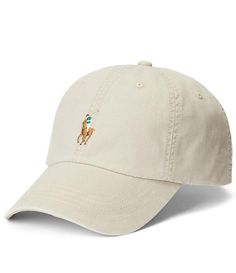 From Polo Ralph Lauren, this cap features:classic baseball cap silhouetteRalph Lauren's signature multicolored Pony embroidered at the frontseamed billsix-panel constructionembroidered ventilating eyeletssweatband at the interior"Polo Ralph Lauren" embroidery and a buckled leather strap at the backApprox. 23 1/4 circumferenceshell is cotton/elastaneback strap is leatherspot cleanImported. Classic Cream Baseball Cap With Curved Visor, Cream Baseball Cap With Embroidered Logo, Cream Curved Brim Baseball Cap With Embroidered Logo, Classic Visor Baseball Cap With Embroidered Logo, Classic Cream Hats With Embroidered Logo, Beige Embroidered Baseball Cap, Classic Trucker Hat With Embroidered Logo Visor, Classic Trucker Hat With Embroidered Logo, Beige Baseball Cap With Embroidered Logo