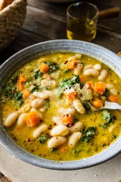 Tuscan white bean soup in a bowl. Tuscan White Bean Soup With Chicken, Vegetarian Hearty Soup, Tuscan Cannellini Bean Soup, Cauliflower Bean Soup, White Bean Dinner Recipes, Leek And White Bean Soup, Hearty Tuscan White Bean Soup, Canelli Bean Soup Recipes, Tuscan Chickpea Soup