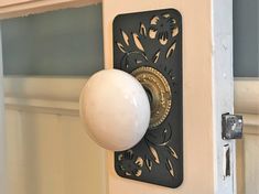 a door handle with a white ball on it