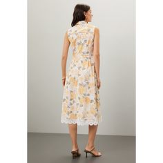 Off-white floral cotton. Casual dress. Sleeveless. Collared neckline. Front button closure. 48" from shoulder to hemline. Imported. Feminine Sleeveless Dress For Spring Daywear, Summer A-line Floral Day Dress, White Sleeveless Dress For Summer, White Casual Sleeveless Dress For Summer, Summer Midi Sleeveless Dress With Lace Trim, Floral Print Knee-length Sleeveless Day Dress, Feminine Sleeveless Dress With Lace Trim For Summer, Floral Print Knee-length Sleeveless Dress For Daywear, Knee-length Floral Sleeveless Dress For Daywear