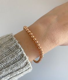 "14K Real Rose Gold Solid Ball Bracelet.. Perfectly Worn Alone Or Layered. 7\" inch With A 1 Inch Extension. A Beautiful Gift She Will Treasure Forever! Jewelry Comes In A Cute Gift Box Ready To Present.  - All Jewelry Is New And Inspected For Quality Assurance. -Jewelry Is Crafted In Genuine High Quality 14K Gold. -We Do Not Sell Gold Plated.  Product Detail: Metal: 14k rose gold  Width: 4mm Weight: 6.60 grams   Length: 7\" inch with 1 \" extension Closure: lobster claw  ✨ Feel Free To Ask Me Any Questions Or Concerns You May Have ✨ 🌈 Follow Me @Sarakayjewelry Thank You For Visiting My Shop" Adjustable Rose Gold Beaded Bracelets In 14k Gold, Dainty Rose Gold Stackable Beaded Bracelets, Rose Gold Jubilee Beaded Bracelet As Gift, Dainty Rose Gold Bracelet With Round Beads, Elegant Gold Bracelet With Spacer Beads For Gift, Rose Gold Jubilee Beaded Bracelets For Everyday, Rose Gold Beaded Bracelets As Gift, Dainty Rose Gold Bracelets With Round Beads, Rose Gold Beaded Jubilee Bracelet For Everyday