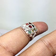 Genuine 925 Sterling Silver Navratan Ring Gemstone - Ruby , Emerald , Blue Sapphire, Yellow Sapphire, Hessonite, Cats Eye, Coral, Pearl, Cubic Zircona. Ring Size - QTY - 1 piece in this listing. The navratna or nine gems influencing the nine planets are: Ruby = Sun , Pearl = Moon, Red Coral = Mars, Emerald = Mercury, Yellow Sapphire = Jupiter, zircon = Venus, Blue Sapphire = Saturn, Hessonite = Rahu , Cat''s Eye = Ketu . Spiritual Multi-stone Promise Ring, Spiritual Sterling Silver Rings With Accent Stones, Spiritual Silver Rings With Accent Stones, Spiritual Sterling Silver Multi-stone Rings, Spiritual Multi-stone Sterling Silver Rings, Sterling Silver Multi-stone Emerald Promise Ring, Silver Multi-stone Promise Ring, Sterling Silver Multi-stone Open Ring, Unique Multi-stone Sterling Silver Rings