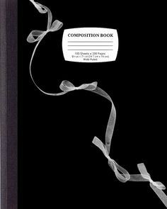 the composition book is black and white with ribbon