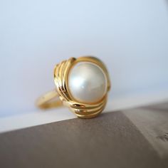 Natural Mabe Pearl Ring With s925 Sterling Silver|Vintage Pearl Jewelry|Statement Pearl Ring silver|Everyday Real Pearl ring\gift for mom 💚💚 Specifics: 💚Materials: Natural Mabe Pearl With 24k gold plated s925 silver 💚Size: 17mm*17mm 💚Closure: the closure is made of 925 sterling silver.  💚Metal: Gold plated s925 silver 💚Handmade Artwork, original design and copyright protected💚 💚The ring size is adjustable, ensuring a comfortable fit for various finger sizes. You can easily customize it Polished Finish Pearl Ring As Gift, Heirloom Jewelry With Classic Design For Gifts, Heirloom Jewelry Classic Design Gift, Heirloom Jewelry With Classic Design As Gift, Heirloom Jewelry With Classic Design Gift, Vintage Pearl Ring For Gift, Vintage Oval Pearl Ring For Gift, Vintage Oval Pearl Ring Gift, Vintage Jewelry With Classic Design For Gift