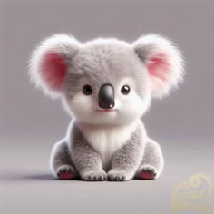 a small stuffed koala bear sitting on top of a white floor next to a gray background