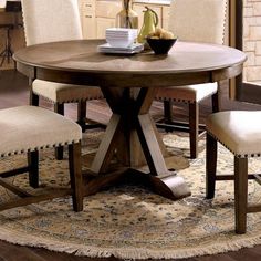 a dining room table with chairs around it