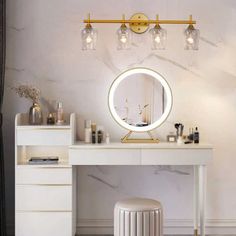 a vanity with a mirror, stool and lights on top of it in a room