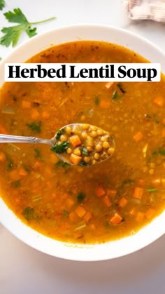 a white bowl filled with soup and garnished with parsley on the side