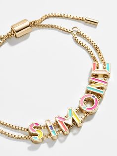 The brightest among our collection of Custom Slider Bracelets is our Multi Enamel style. This special bracelet features two strands of a box chain, an easy-to-adjust pull-tie closure, and vibrant gold and enamel beads. Choose a name, initials, or favorite phrase to customize your bracelet with - it's sure to be your new everyday staple. See our Letter Key for all options available. Please note, we're unable to produce bracelets with profanity. Preppy Accessories, Preppy Jewelry, Name Initials, Enamel Beads, Jewelry Accessories Ideas, Dope Jewelry, Gold Bead Bracelets, Jewelry Lookbook, Girly Jewelry