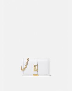 Versace Greca Goddess Mini Bag for Women | US Online Store White Evening Bag With Metal Logo, Timeless Rectangular Bags With Logo Hardware, Timeless Rectangular Bag With Logo Hardware, Elegant Crossbody Bag With Logo Hardware, Chic Wallet On Chain With Metal Logo For Everyday, Timeless Rectangular Wallet On Chain With Strap, Luxury White Rectangular Wallet On Chain, Elegant White Crossbody Wallet On Chain, Evening Wallet On Chain With Metal Logo