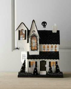 a white and black halloween house with windows