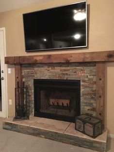 a fireplace with a flat screen tv above it