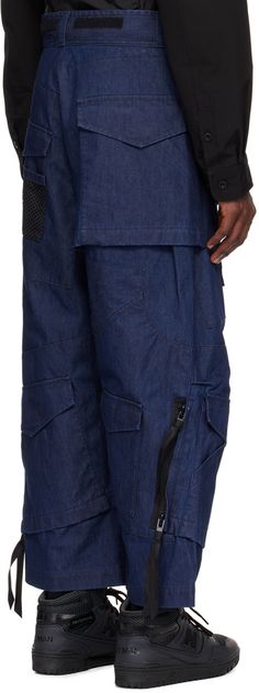 Non-stretch chambray jeans. Flap pockets throughout. · Paneled construction · Belt loops · Velcro detailing at waistband · Zip-fly · Mesh pocket at front and back leg · Tucks at knees · Two-way zip detailing at outseams · Bonded nylon taffeta lining Part of the Junya Watanabe MAN collection. Supplier color: Indigo Indigo Denim Jeans With Pockets, Medium Wash Rigid Denim Pants With Side Pockets, Urban Dark Wash Pants With Pockets, Medium Wash Denim Pants With Side Pockets, Urban Style Dark Wash Cargo Pants With Hip Pockets, Utility Jeans In Recycled Denim, Utility Style Jeans With Side Pockets In Recycled Denim, Urban Dark Wash Cargo Pants With Hip Pockets, Medium Wash Rigid Denim Pants With Pockets