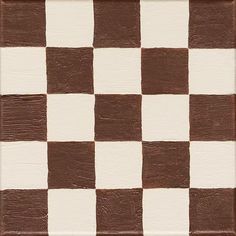 a brown and white checkerboard pattern is shown on the wall in this photo