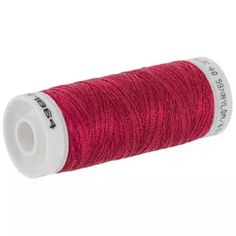 red thread spool on white background