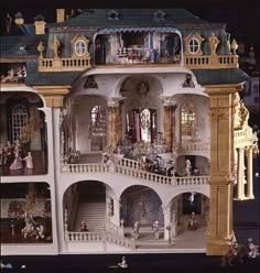 a doll house with many rooms and stairs