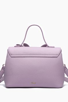 Effortlessly chic, the Jasmine Bowtie Crossbody Purple Bag is the perfect compact size that exudes modern elegance. Gold tips and ornaments with functional compartments to aid in a day of exploring the city or a classic dinner date. - 9 3/4"W x 7"H x 5"D - Luxurious Vegan Leather - Top handle drop: 4'' - Strap: 23" Adjustable/Detachable - Magnetic snap and zipper - 1 inner compartment divider, 1 inner zipper pocket Elegant On-the-go Backpack With Detachable Handle, Feminine Rectangular Bag For On-the-go, Chic Backpack With Detachable Strap And Top Handle, Chic Backpack With Detachable Strap, Chic Shoulder Bag With Detachable Handle And Backpack Shape, Chic Backpack With Top Handle And Removable Pouch, Purple Bag With Detachable Strap For On-the-go, Purple Satchel Bag With Detachable Strap, Elegant Satchel With Removable Pouch In Backpack Style