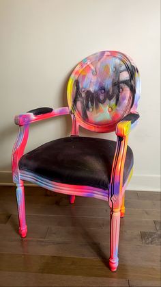 a chair that has been painted with different colors