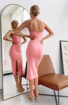 Pink Bodycon Midi DressExpect endless compliments in this gorg dress!Asymmetrical necklineThin shoulder strapsFigure huggingLeg slit on left sideUnlinedMidi lengthZip at the backThin soft material with stretch Pink Dress With Heels, Sky Blue Midi Dress, Pink Bodycon Midi Dress, Pink Bodycon, Midi Dress Pink, Prom Midi Dress, Dress Asymmetrical, Semi Formal Dresses, Bodycon Midi Dress