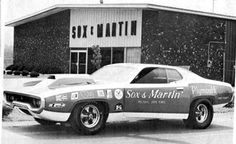 an old black and white photo of a car parked in front of a building with the word sox & martini on it