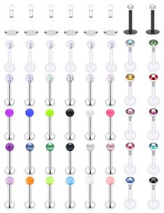 an assortment of different colored belly rings