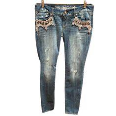 Nwt! Msrp $118! Medium Wash Distressed Denim By Express. Gorgeous Crystals In Clear And Smoke Gray In Various Shapes And Sizes Adorn The Front And Rear Pockets. Low Rise, Ultra Skinny’s. Zip And Single Button Closure. Size 4 Embellished Fitted Dark Wash Jeans, Fitted Embellished Medium Wash Jeans, Casual Embellished Jeans For Fall, Casual Blue Embellished Jeans, Casual Embellished Denim Blue Jeans, Salmon Pants, Low Rise Leggings, High Rise Black Jeans, Metallic Jeans