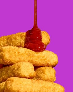 a pile of fried food with ketchup on top