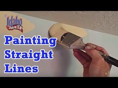 a person is painting a ceiling with paintbrushes in their hands and the words, painting straight lines