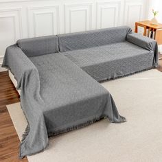 a couch with a blanket on top of it