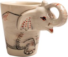 an elephant shaped coffee cup with red and white designs on it's side, in front of a white background