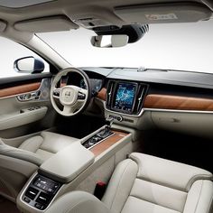 the interior of a car with leather and wood trim