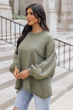 Stay cozy and chic this season wearing this Exposed Seam Pocket Sweater, which is available in TWO colors: Olive & Rust! Crafted from a blend of 60% cotton and 40% acrylic, this sweater features a round neckline, long sleeves with ribbed cuffs, and an oversized fit for comfort. The exposed seam detail and single chest pocket add a touch of style. Pair with jeans, strappy heels, and a chic little clutch for an elevated everyday outfit. Sorority Rush Outfits, Rush Outfits, Gameday Dress, Loungewear Dresses, Pocket Sweater, Casual White Dress, Game Dresses, Everyday Outfit, Stay Cozy