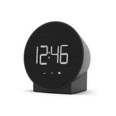 an alarm clock with the time displayed on it's display screen, in front of a white background