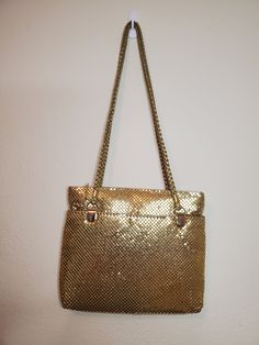 Beautiful gold metal sequin vintage purse. Looks to have never been used. Vintage Gold Shoulder Bag For Party, Gold Sequined Bags For Party, Gold Sequined Party Bag, Gold Sequin Party Bag, Glamorous Gold Shoulder Bag For Everyday Use, Gold Party Bags With Sequins, Metallic Shoulder Bag With Gold-tone Hardware For Party, Vintage Gold Shoulder Bag For Formal Occasions, Vintage Gold Shoulder Bag With Gold-tone Hardware