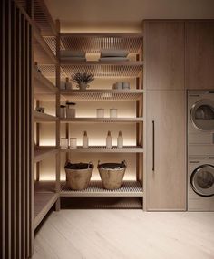 a washer and dryer in a room with wooden shelves