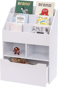 a white book shelf with books and a stuffed animal in it's drawer underneath