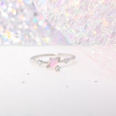 Need some space? Then this is the ring for you! Our I Need Space Ring features a Girls Crew signature pink gem that is so flirty and feminine. 18k gold plated, 18k rose gold plated, or rhodium plated over brass with a protective coating Cubic zirconia stones Available in sizes 6-8 5mm width Shop our entire GC Galaxy Collection here! Pink Cute Rings For Anniversary, Pink Sterling Silver Crystal Open Ring, Cute Pink Round Rings, Adjustable Pink Rings For Proposal, Pink Crystal Ring For Valentine's Day, Cute Pink Rings For Promise, Pink Dainty Crystal Ring For Anniversary, Dainty Pink Crystal Ring For Anniversary, Pink Open Ring Jewelry For Proposal