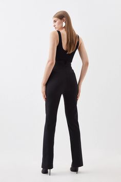 Exude undeniable sophistication in these trousers. A high waistline cinches the waist for a flattering fit, while a notched design and split hem detail adds a contemporary touch. Sumptuous compact stretch fabric skims the form elegantly. From the office to evening drinks, these trousers can be relied on for every setting.High waistSplit hemSlim fitRegular lengthExpertly designed for those 5'3" and under, our Petite pieces are perfectly proportioned for a smaller frame using shorter lengths. Split Hem Pants, Hem Pants, How To Hem Pants, Straight Trousers, Slim Fit Trousers, Straight Leg Trousers, Karen Millen, Straight Pants, Split Hem