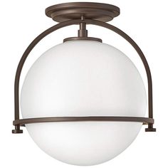 a light fixture with a white glass ball hanging from the bottom and an iron frame around it