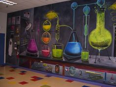 this is a painting on the wall of a science lab with colorful flasks and beakles