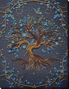 an intricately designed tree with blue and gold beads